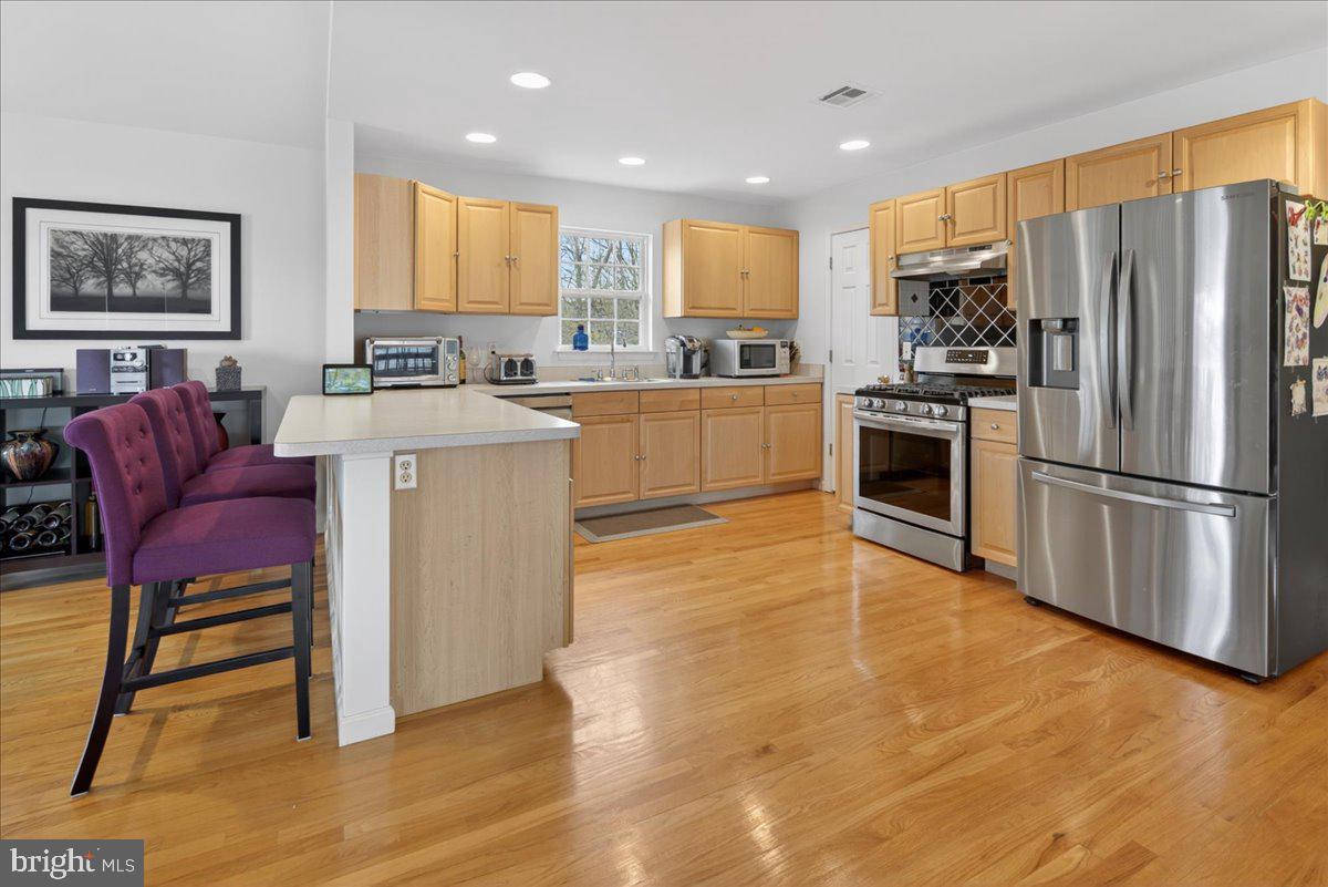 116 Marine Road Waretown, NJ 08758 - Photo 27 of 67 a kitchen with stainless steel appliances granite countertop a refrigerator and a stove top oven