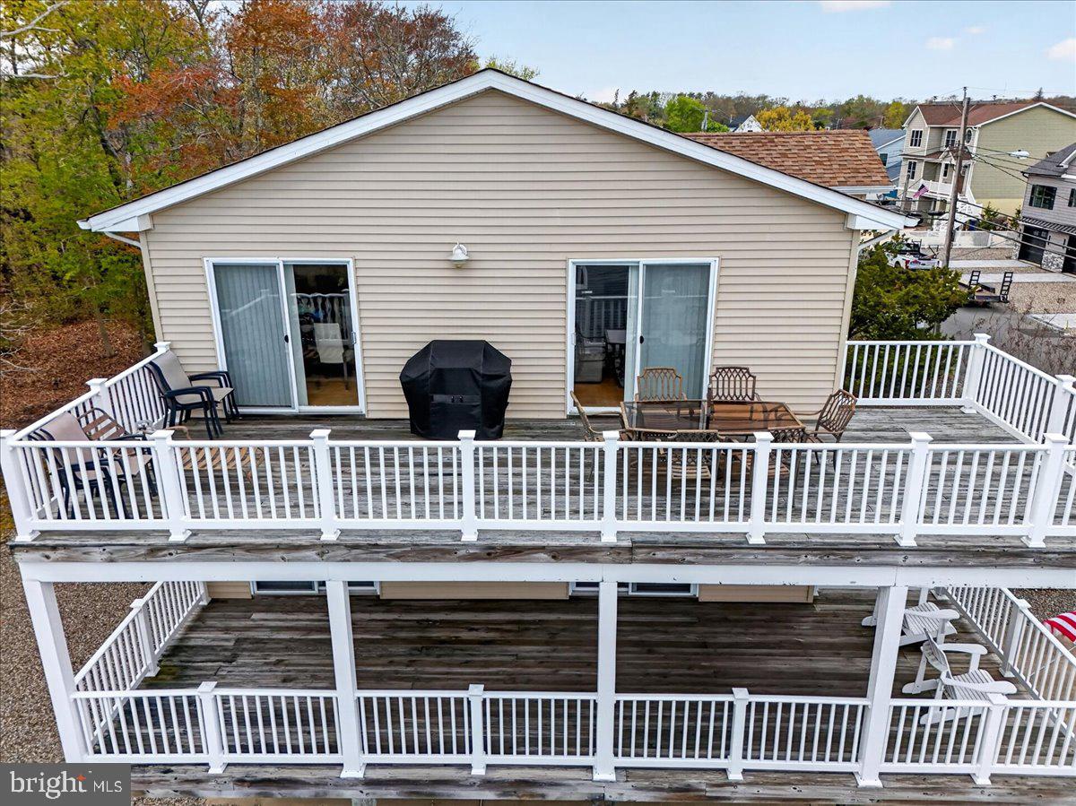116 Marine Road Waretown, NJ 08758 - Photo 43 of 67 a front view of a house with a deck