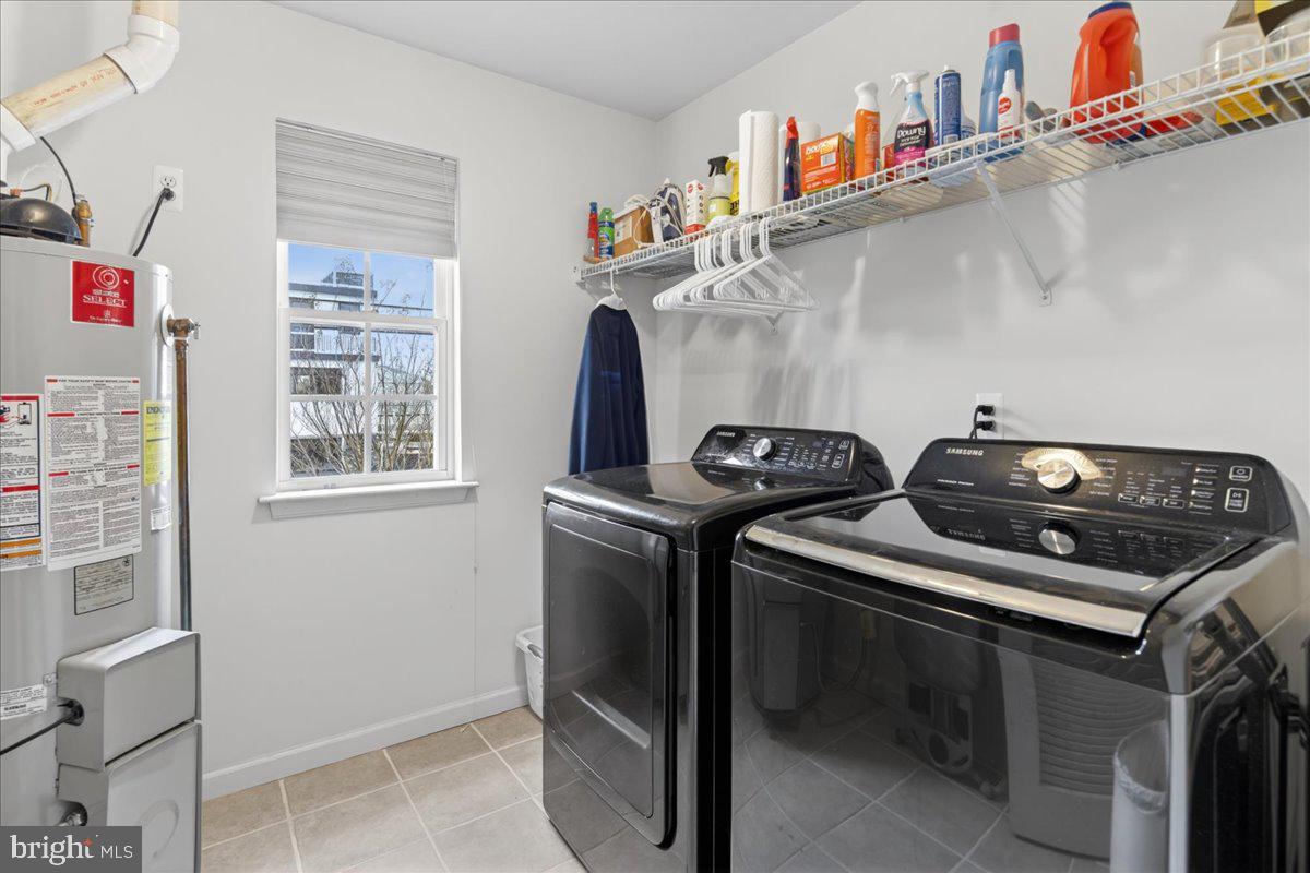 116 Marine Road Waretown, NJ 08758 - Photo 6 of 67 a utility room with dryer washer and a fridge