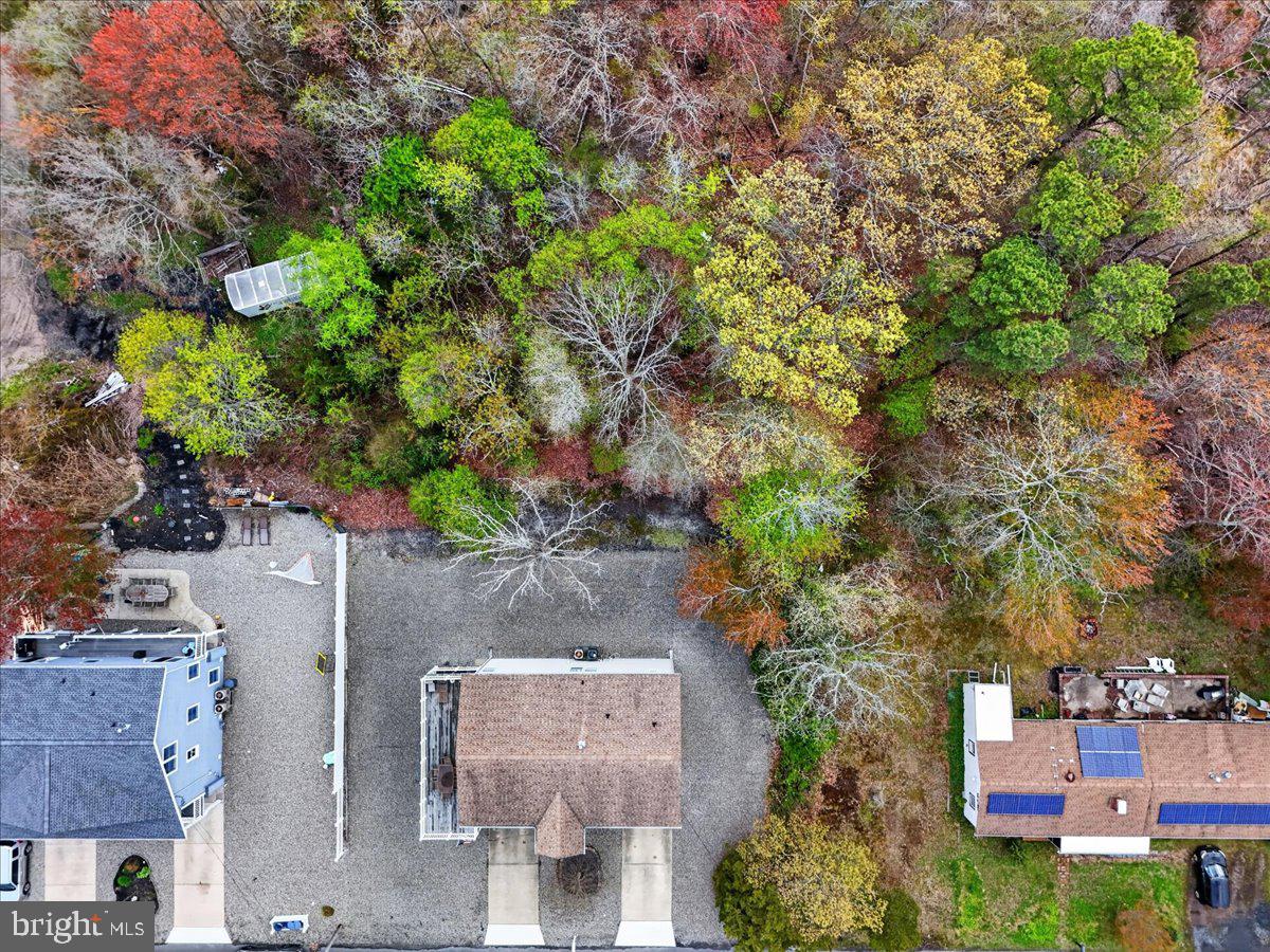116 Marine Road Waretown, NJ 08758 - Photo 61 of 67 an aerial view of a house with yard outdoor seating and covered with trees