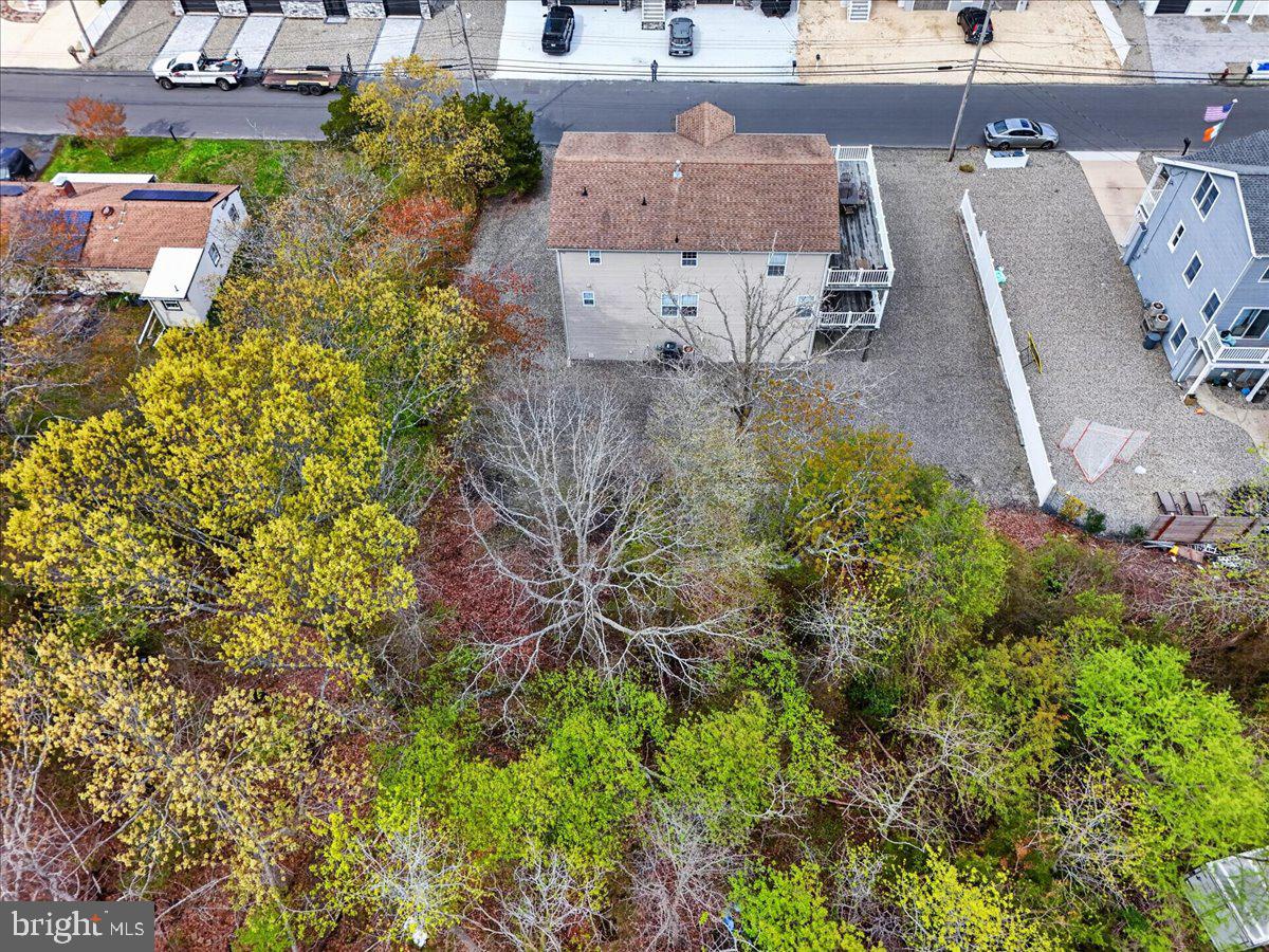 116 Marine Road Waretown, NJ 08758 - Photo 64 of 67 an aerial view of a house with a yard and large trees