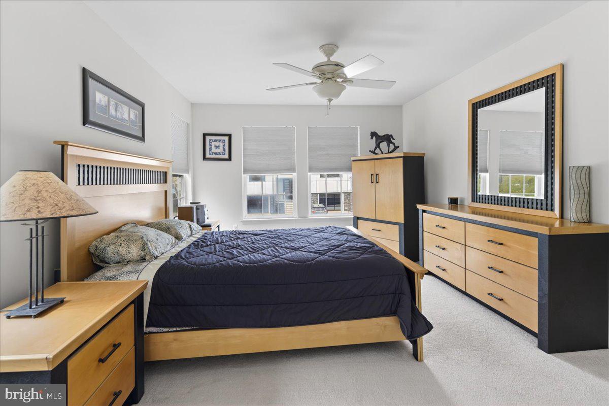 116 Marine Road Waretown, NJ 08758 - Photo 8 of 67 a bedroom with a bed and a chandelier