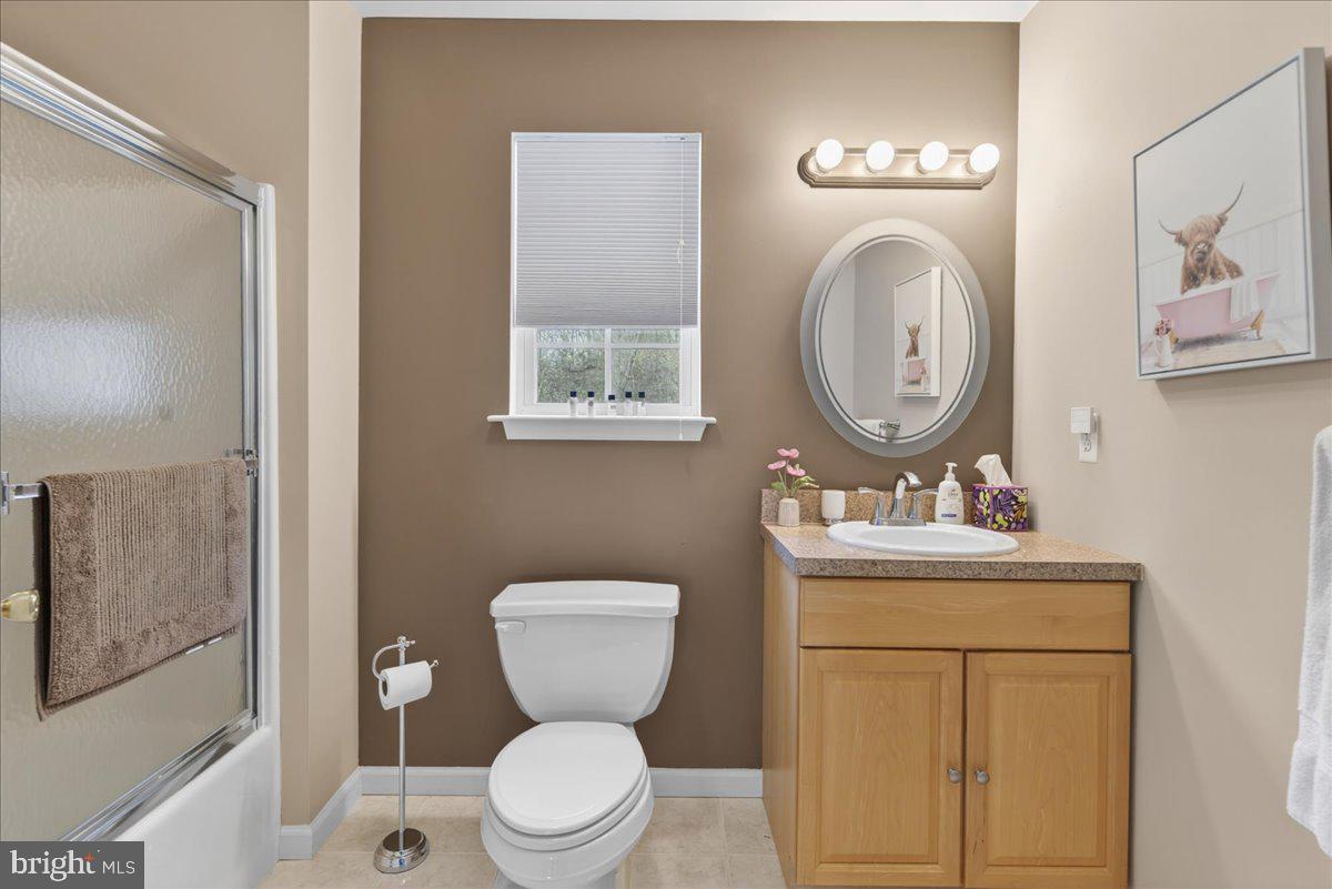116 Marine Road Waretown, NJ 08758 - Photo 10 of 67 a bathroom with a toilet a sink and mirror
