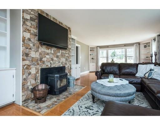 29 Swift Road Northbridge, MA 01588 - Photo 4 of 28 a living room with furniture a flat screen tv and a fireplace