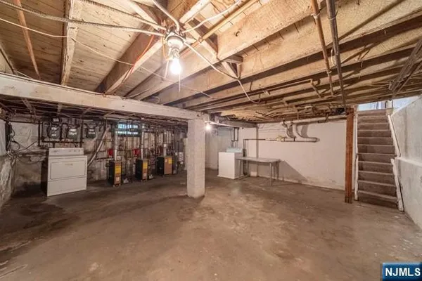 a view of empty room with wooden ceiling