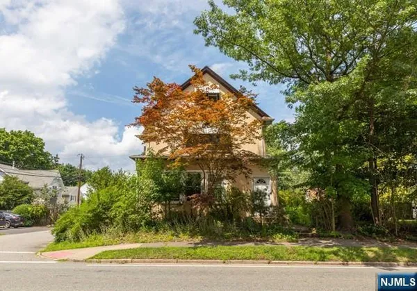 a view of swimming pool and trees in the background