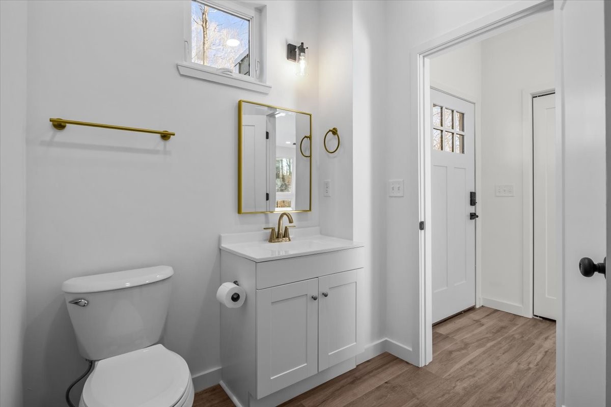 1050 Promise Land Road Charlotte, TN 37036 - Photo 12 of 29 a bathroom with a toilet a sink and mirror