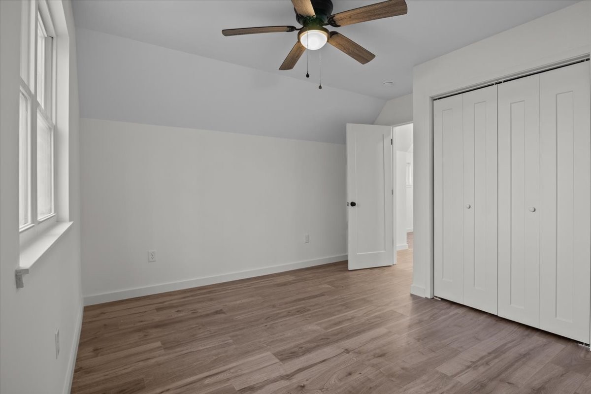 1050 Promise Land Road Charlotte, TN 37036 - Photo 20 of 29 a view of an empty room with wooden floor and a window