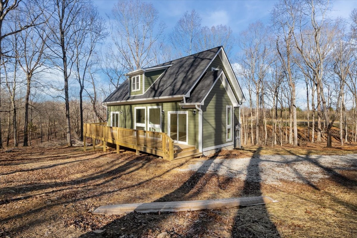 1050 Promise Land Road Charlotte, TN 37036 - Photo 26 of 29 a front view of a house with a yard