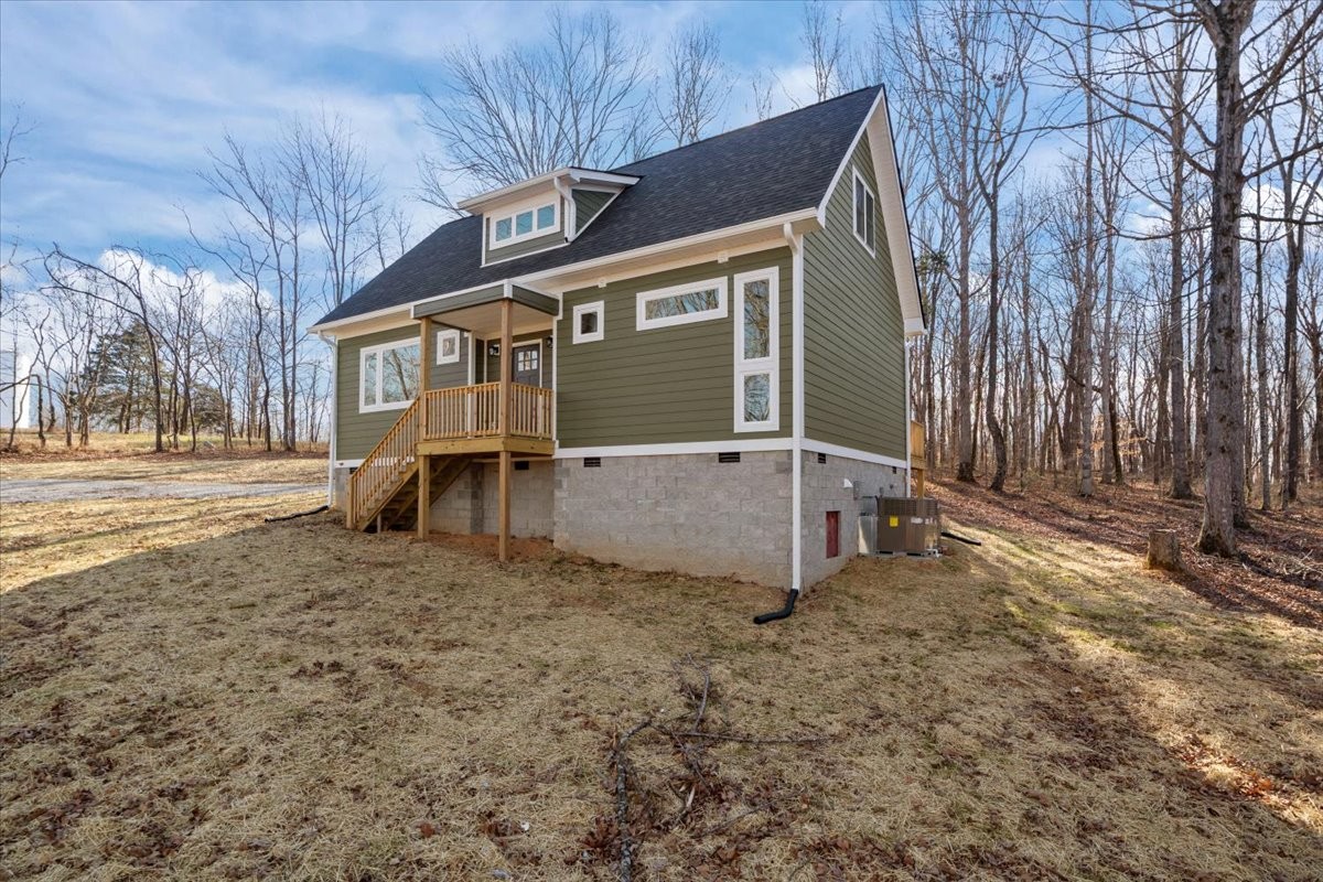 1050 Promise Land Road Charlotte, TN 37036 - Photo 3 of 29 a front view of a house with a yard
