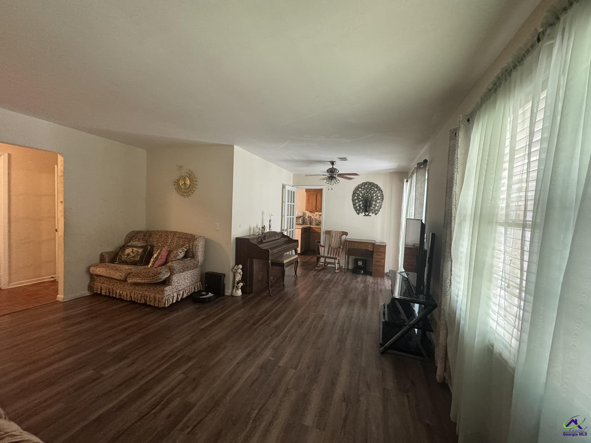 1032 Elberta Road Warner Robins, GA 31093 - Photo 22 of 26 a living room with furniture and a large window