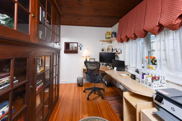 a room with furniture and wooden floor