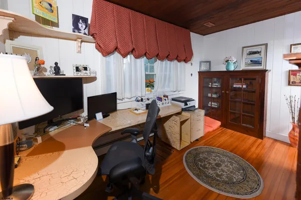 a workspace with furniture and window