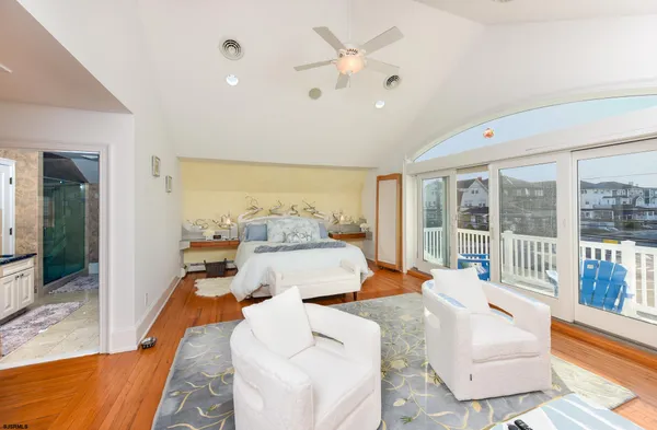 a living room with furniture and large windows