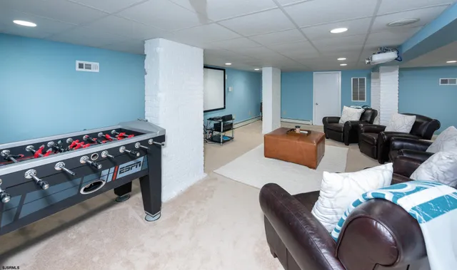 a room with furniture and a flat screen tv