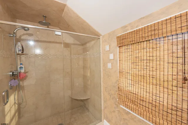 a bathroom with a shower and a toilet