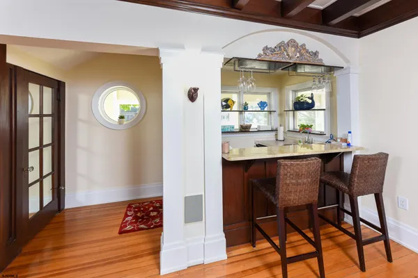 a view of a dining area with furniture and chandelier