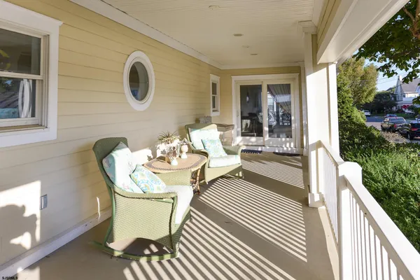 a view of a patio with table and chairs