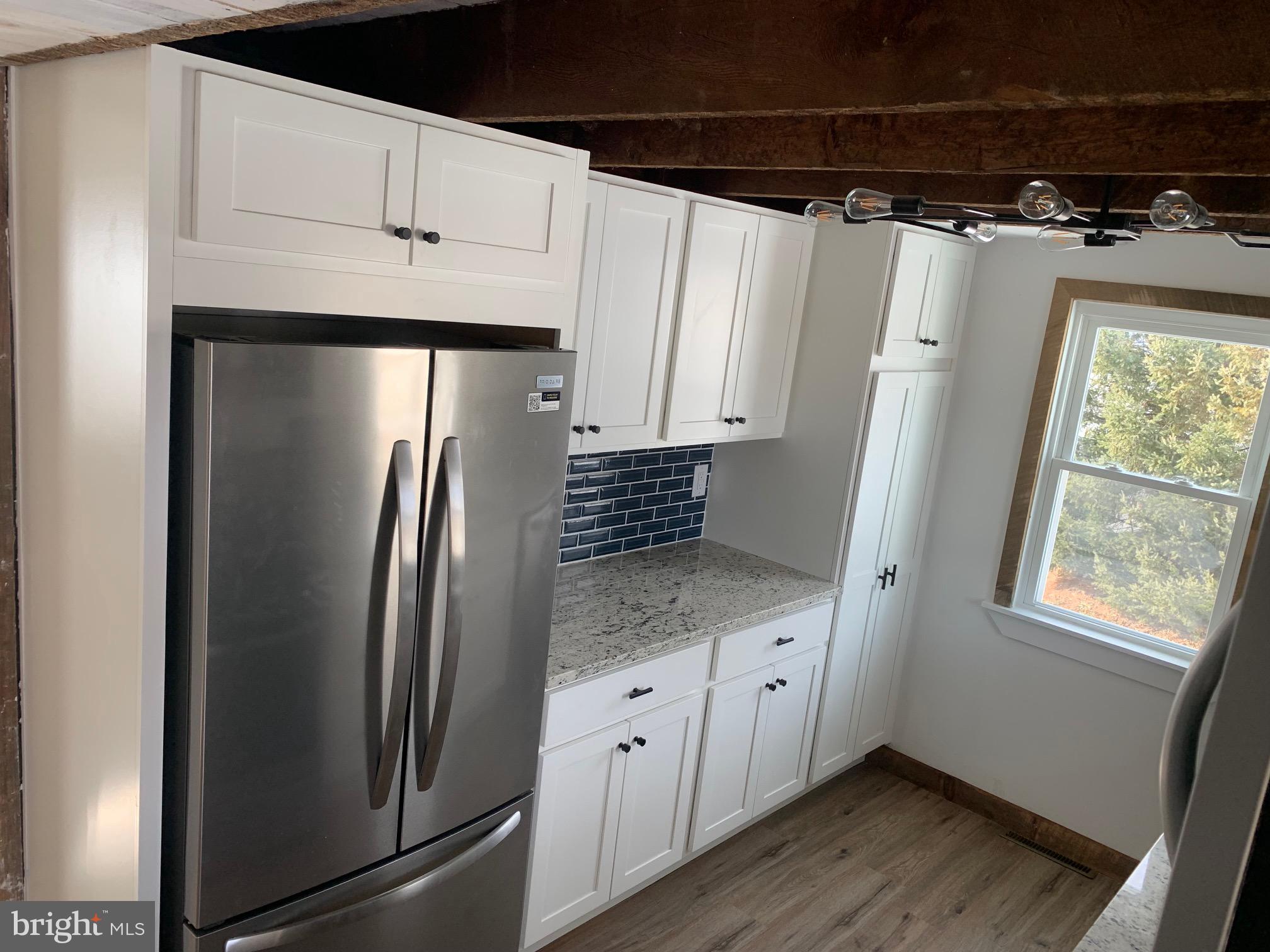 560 Blooming Grove Road Hanover, PA 17331 - Photo 9 of 37 a kitchen with stainless steel appliances a refrigerator and a stove