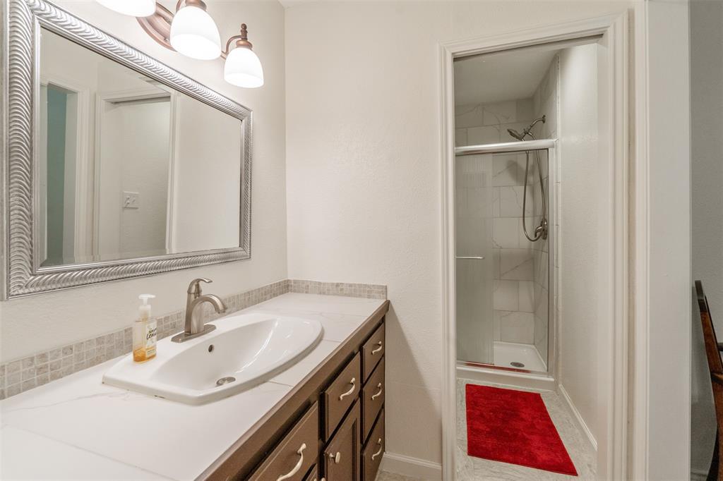12752 Honeysuckle Circle Eustace, TX 75124 - Photo 18 of 28 Bathroom featuring vanity and a shower stall