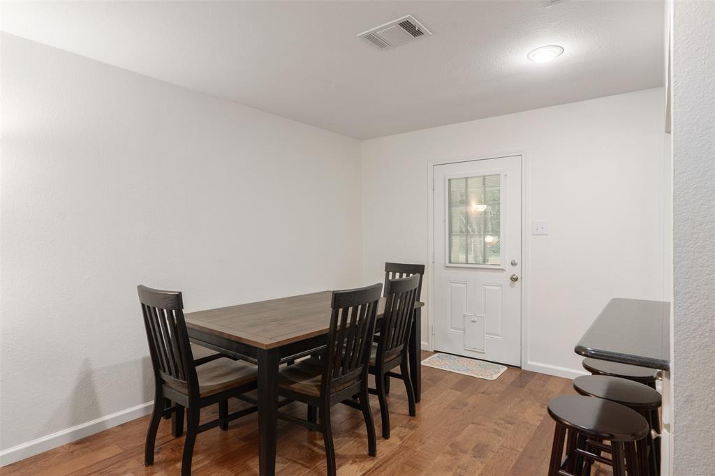 12752 Honeysuckle Circle Eustace, TX 75124 - Photo 9 of 28 Dining room featuring wood finished floors and is right off the kitchen.