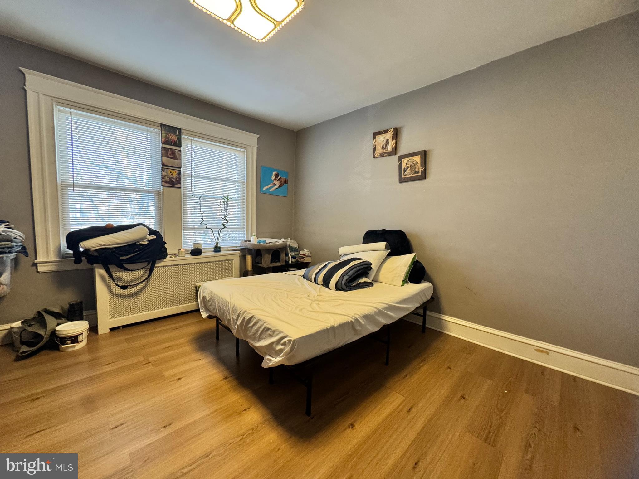 3322 Wellington Street Philadelphia, PA 19149 - Photo 16 of 18 a spacious bedroom with a bed and a window