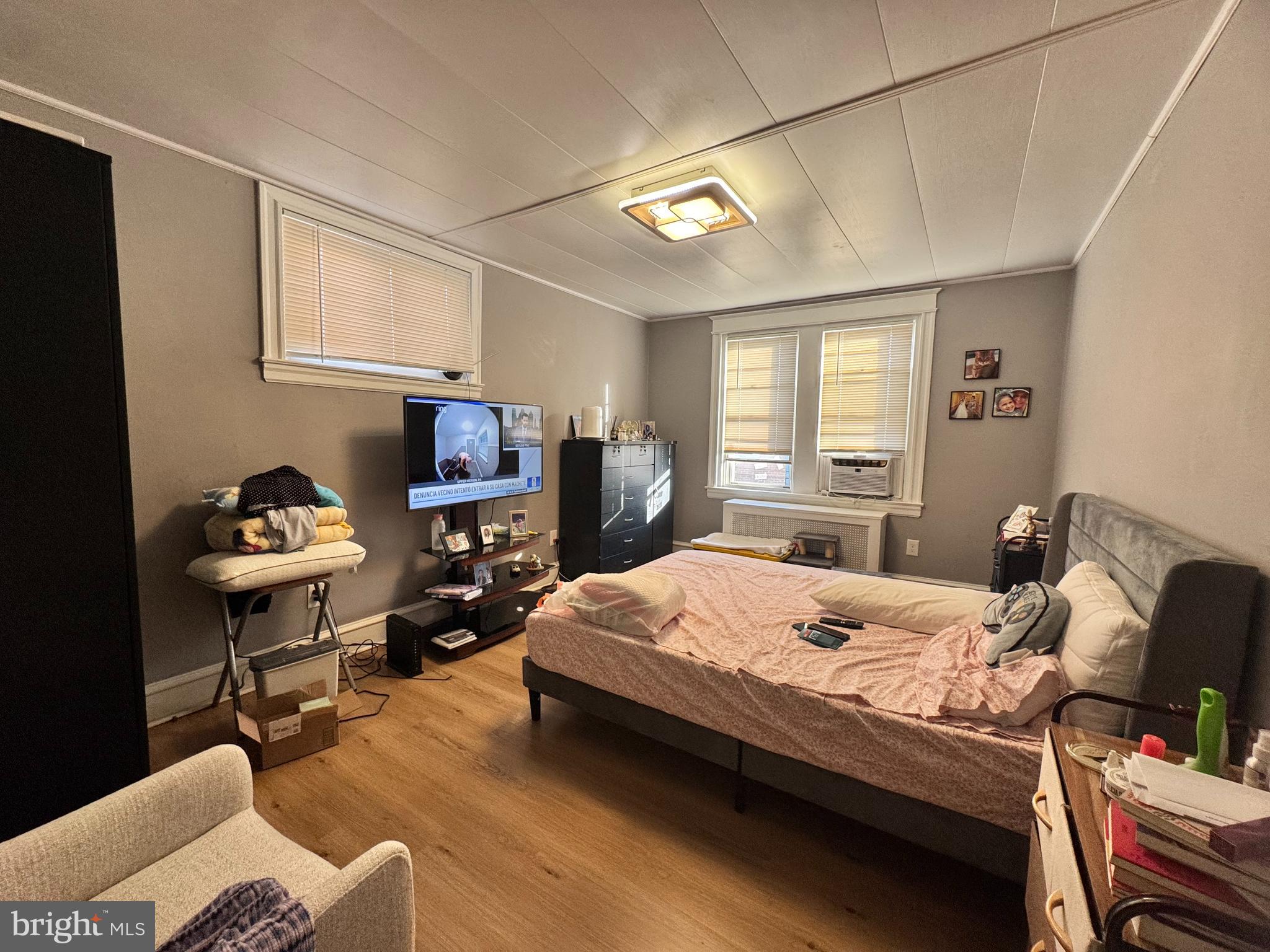 3322 Wellington Street Philadelphia, PA 19149 - Photo 18 of 18 a bedroom with a bed and wooden floor