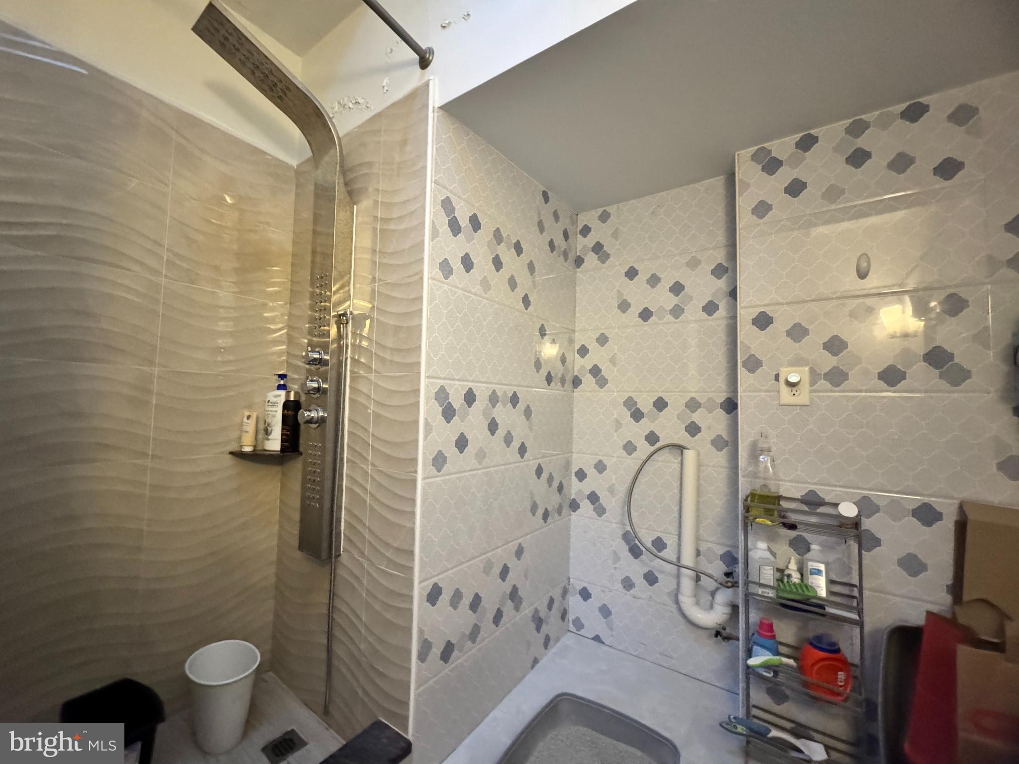 3322 Wellington Street Philadelphia, PA 19149 - Photo 9 of 18 a bathroom with a shower and a toilet