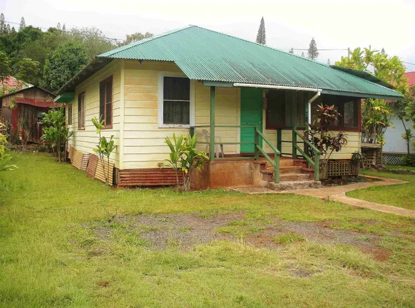 a view of a house with backyard patio and swimming pool