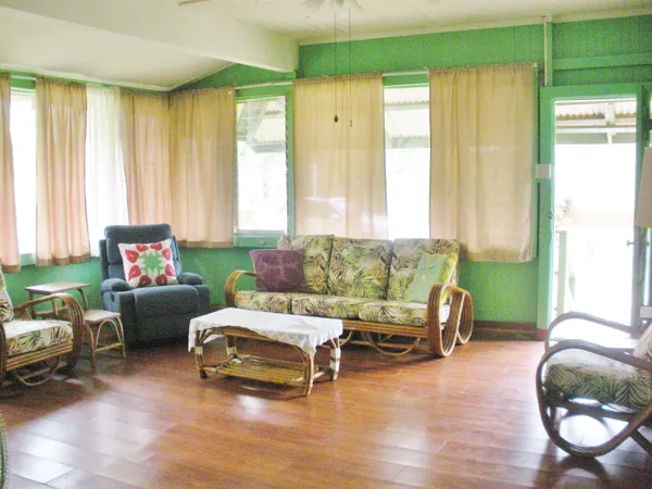 a living room with furniture and a window