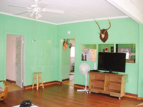 a living room with furniture and a flat screen tv
