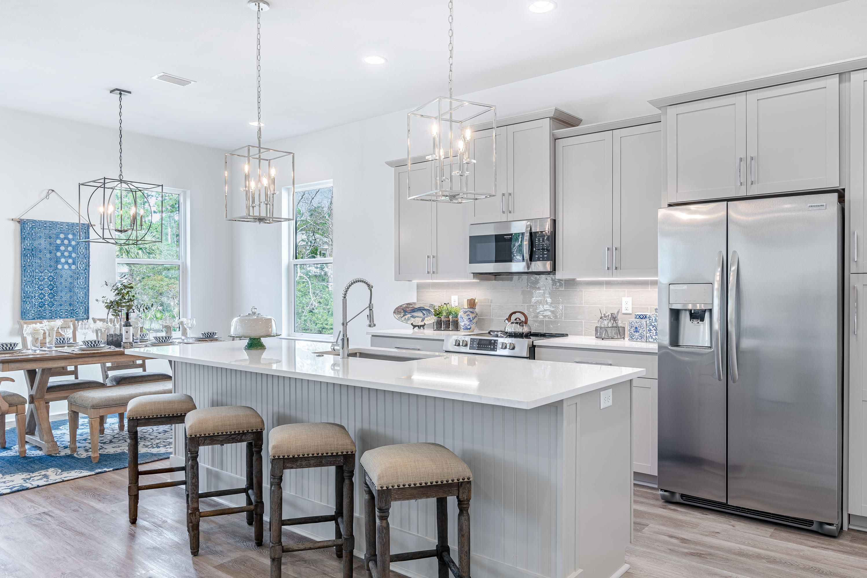 143 Marlberry Santa Rosa Beach Santa Rosa Beach, FL 32459 - Photo 25 of 53 a kitchen with stainless steel appliances granite countertop a sink a stove a refrigerator a center island and a window