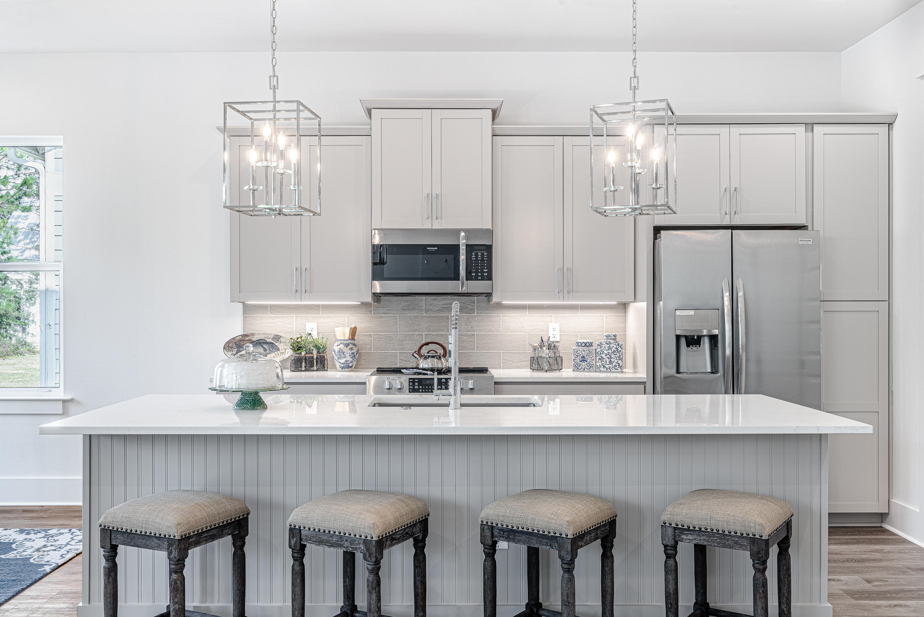 143 Marlberry Santa Rosa Beach Santa Rosa Beach, FL 32459 - Photo 26 of 53 a kitchen with stainless steel appliances granite countertop a kitchen island and chairs in it