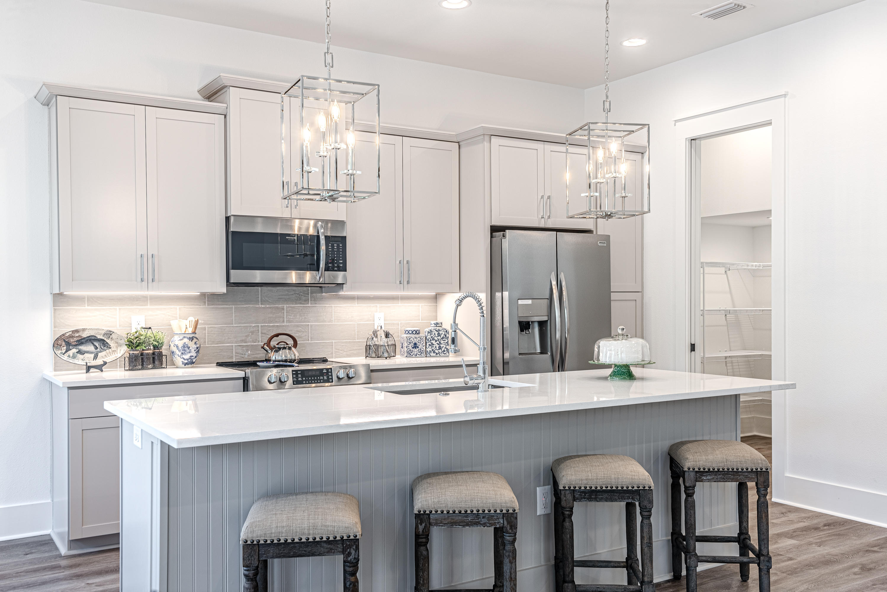 143 Marlberry Santa Rosa Beach Santa Rosa Beach, FL 32459 - Photo 27 of 53 a kitchen with kitchen island granite countertop a sink and refrigerator