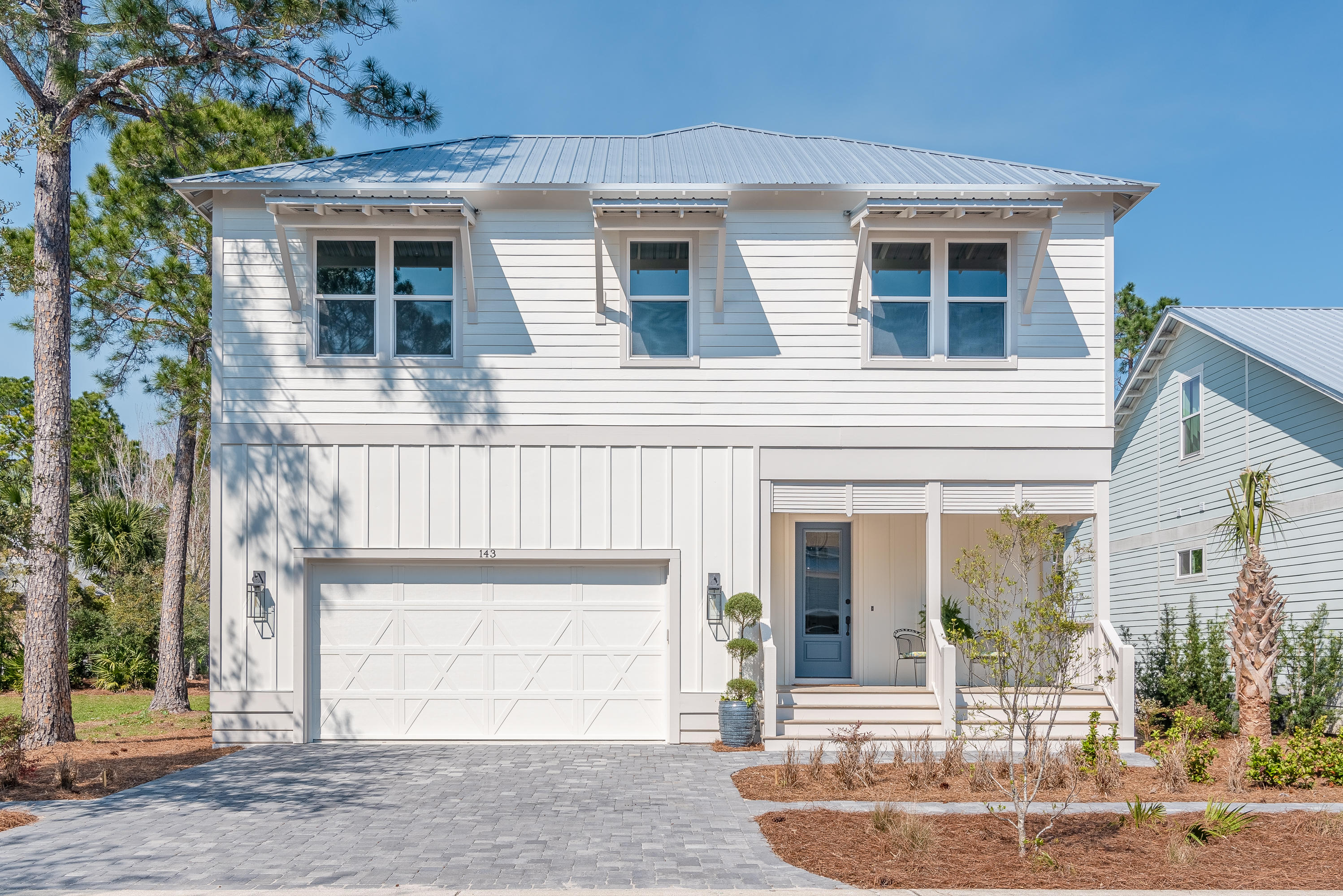 143 Marlberry Santa Rosa Beach Santa Rosa Beach, FL 32459 - Photo 3 of 53 a front view of a house with garden