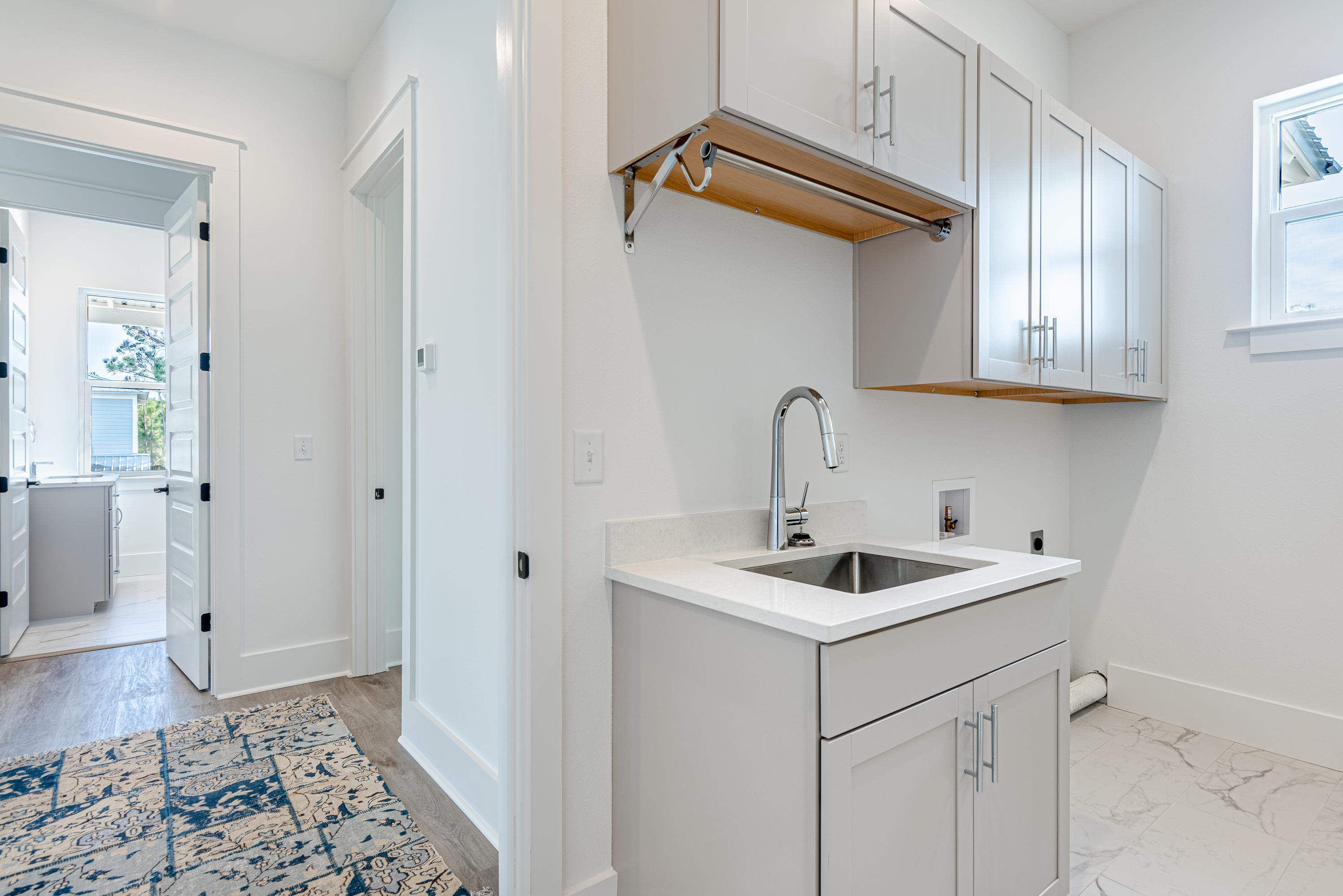 143 Marlberry Santa Rosa Beach Santa Rosa Beach, FL 32459 - Photo 37 of 53 a kitchen with a sink and cabinets