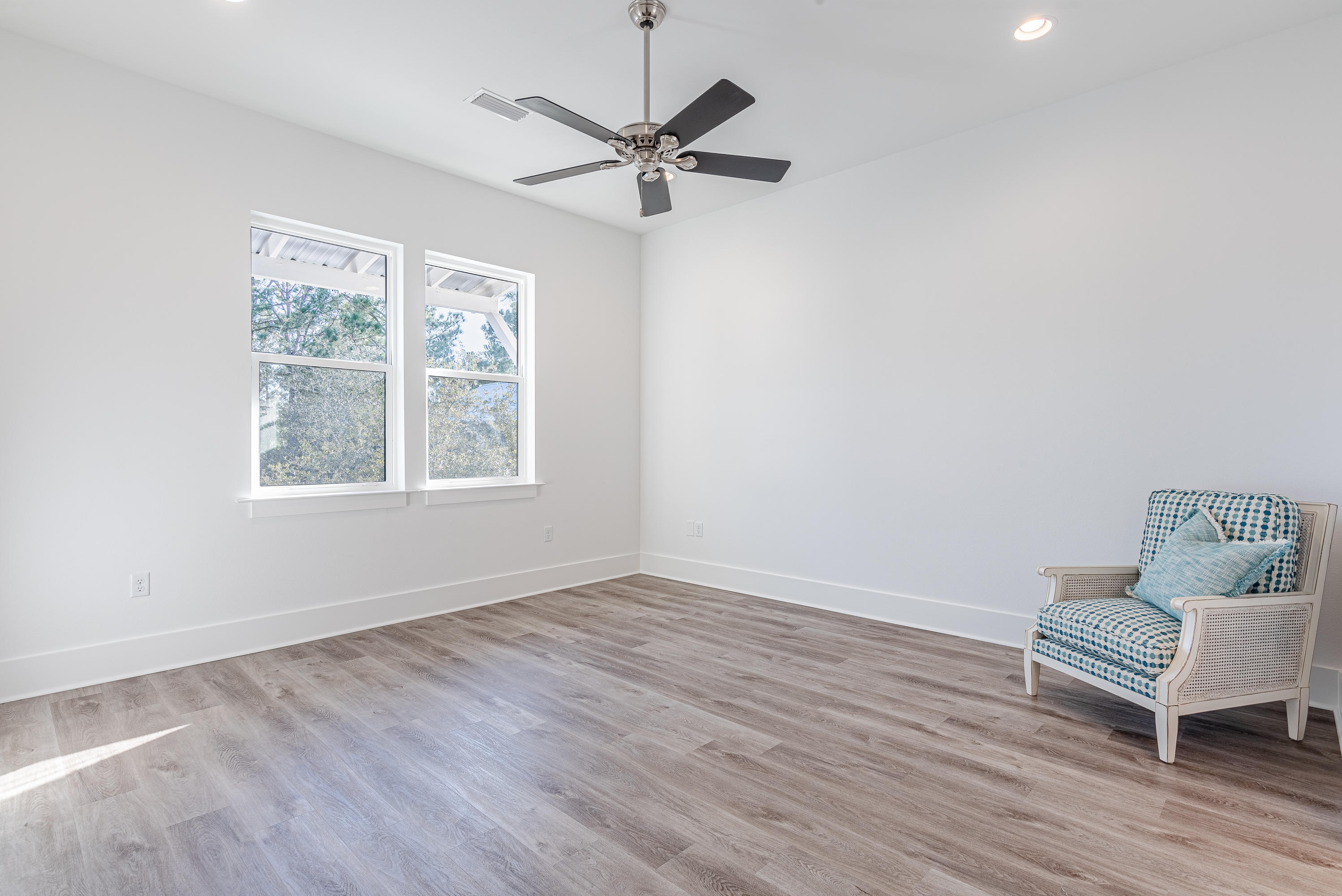 143 Marlberry Santa Rosa Beach Santa Rosa Beach, FL 32459 - Photo 40 of 53 a view of room with wooden floor and a ceiling fan