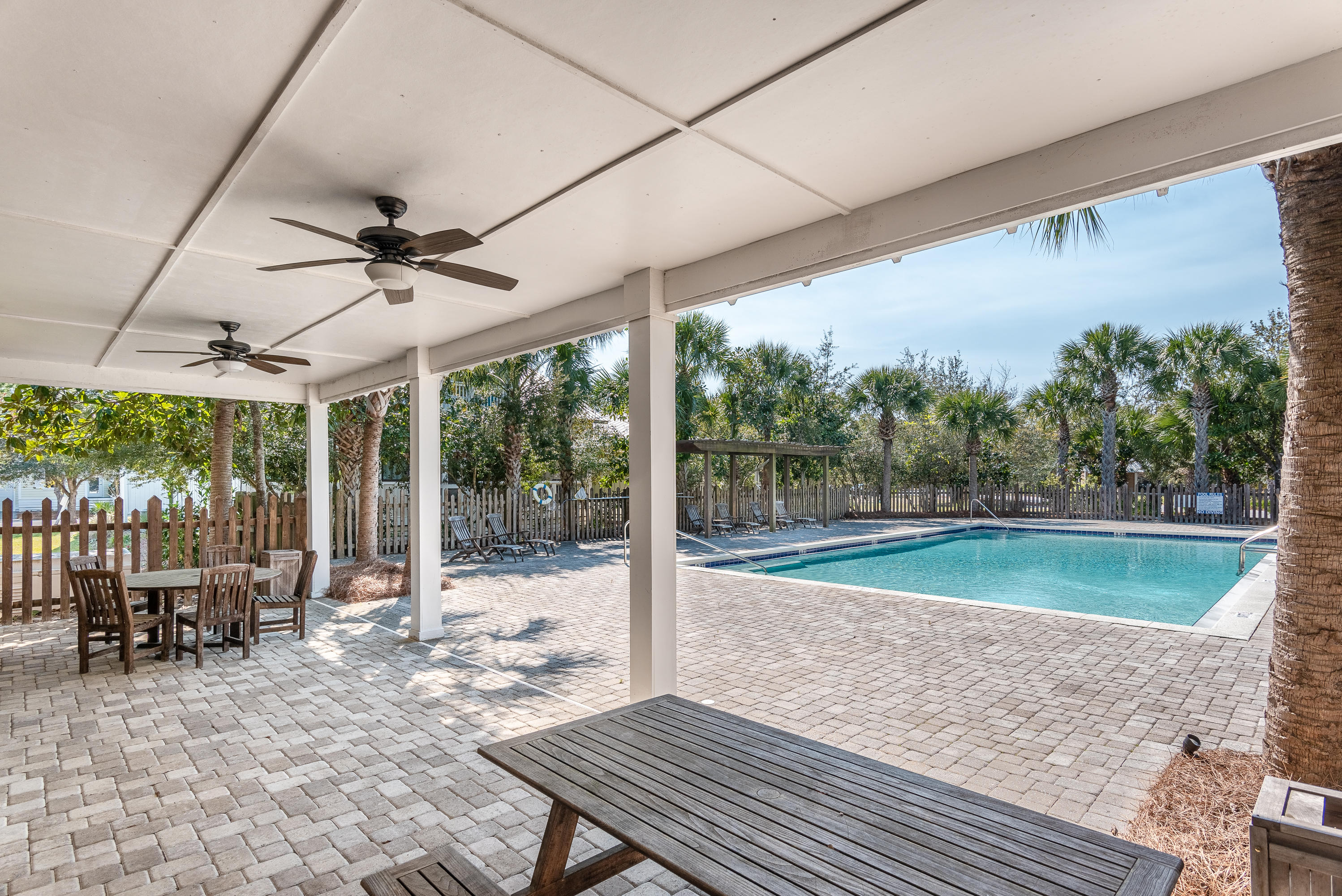 143 Marlberry Santa Rosa Beach Santa Rosa Beach, FL 32459 - Photo 50 of 53 a view of a patio with a table chairs and a backyard