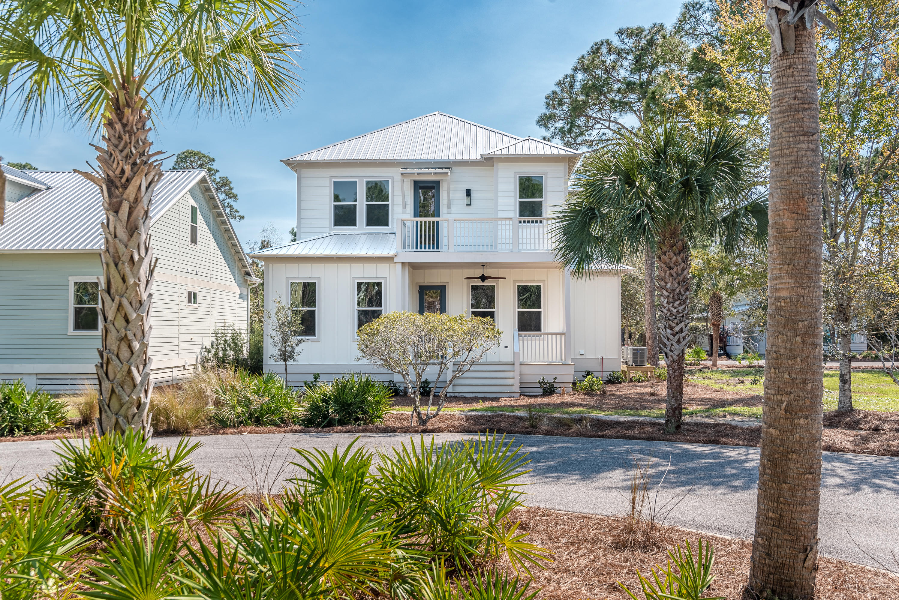 143 Marlberry Santa Rosa Beach Santa Rosa Beach, FL 32459 - Photo 9 of 53 a front view of a house with yard and green space