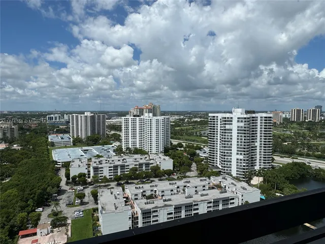 a view of a lake with tall buildings