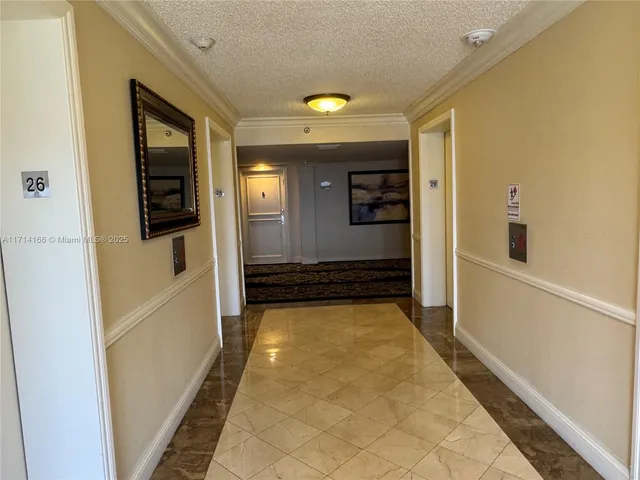 a living room with furniture a chandelier and a dining table