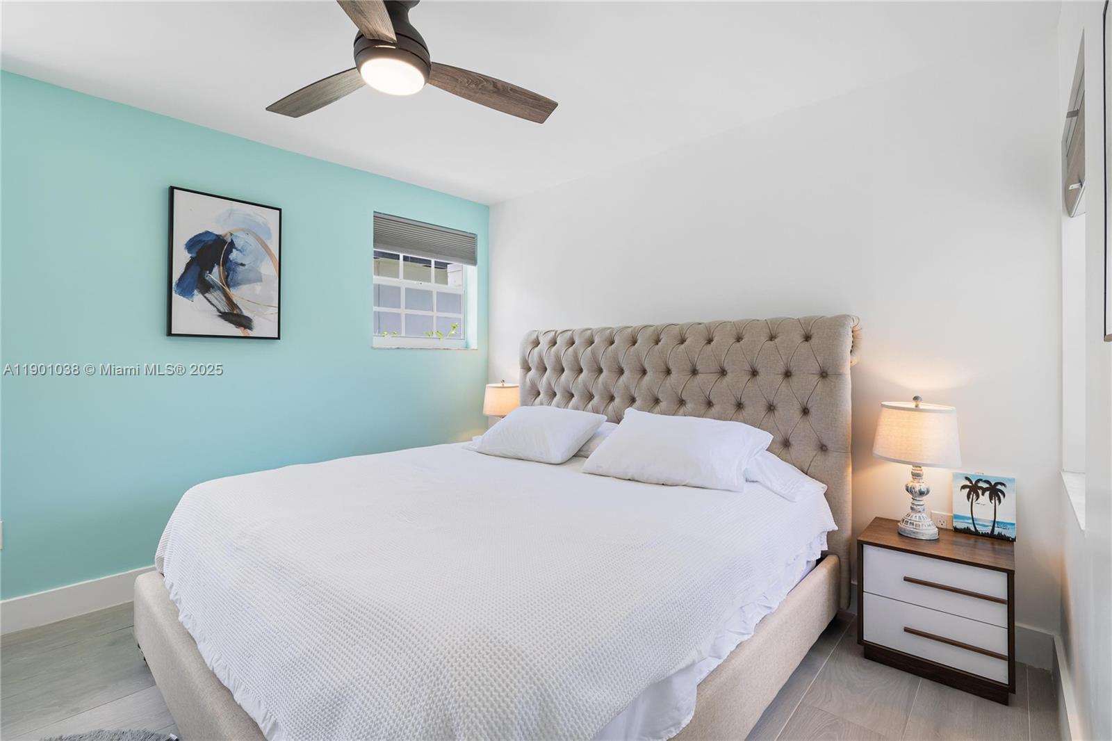 8926 Abbott Avenue Surfside, FL 33154 - Photo 11 of 30 a bedroom with a bed and a painting on the wall
