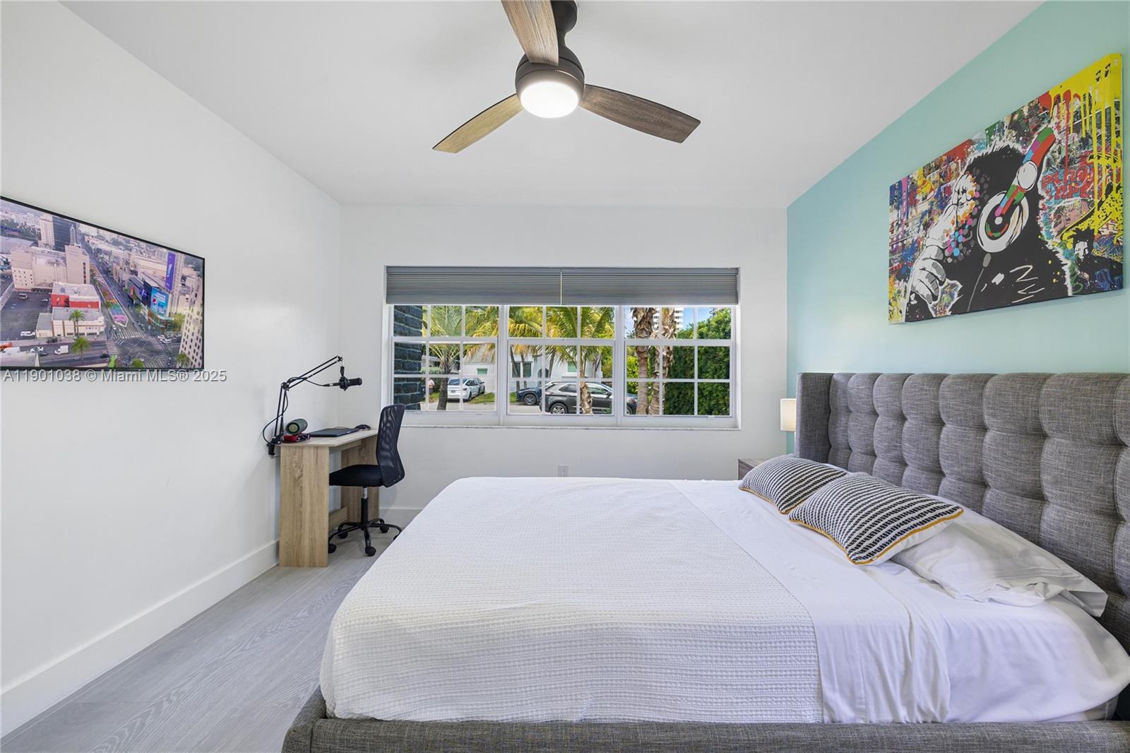 8926 Abbott Avenue Surfside, FL 33154 - Photo 15 of 30 a bedroom with a bed and a chandelier