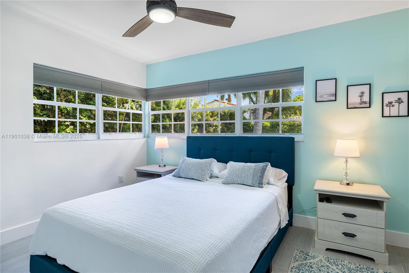 8926 Abbott Avenue Surfside, FL 33154 - Photo 21 of 30 a bedroom with a bed and a window