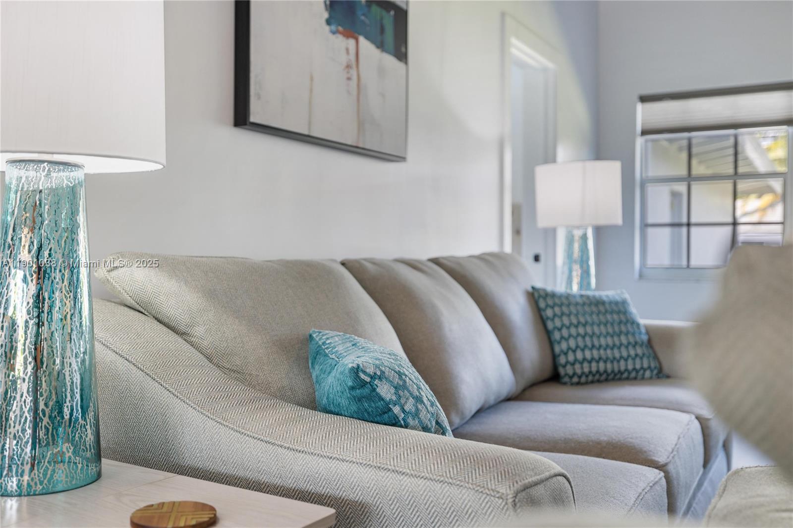 8926 Abbott Avenue Surfside, FL 33154 - Photo 26 of 30 a living room with a couch