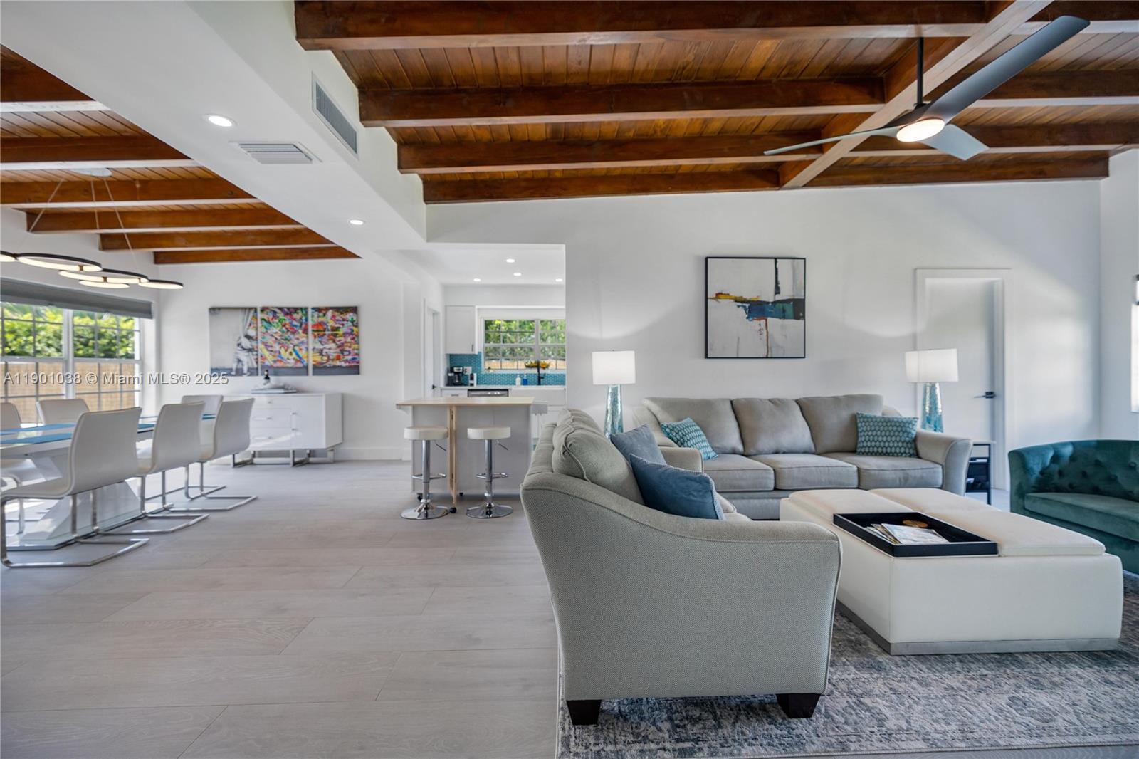 8926 Abbott Avenue Surfside, FL 33154 - Photo 28 of 30 a living room with furniture and a ceiling fan