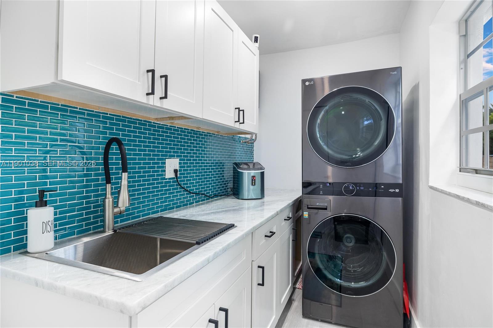 8926 Abbott Avenue Surfside, FL 33154 - Photo 7 of 30 a view of kitchen sink and washer dryer