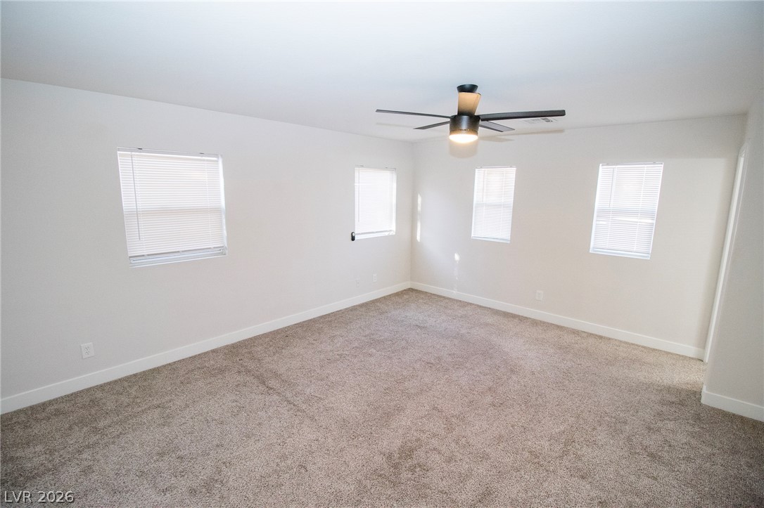 1468 Reef Ridge Court Las Vegas, NV 89128 - Photo 17 of 22 An airy bedroom with fresh carpeting awaits personalization.