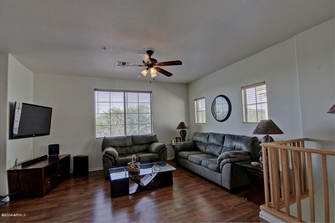 1250 South Rialto, Unit 62 Mesa, AZ 85209 - Photo 2 of 24 a living room with furniture and a flat screen tv