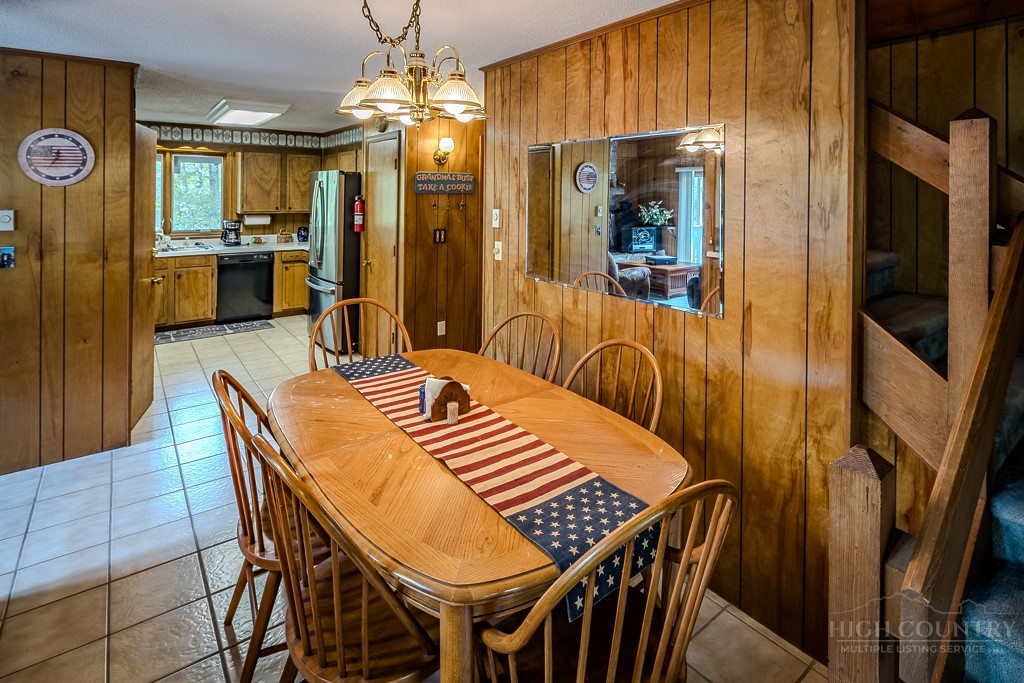107-109 Shagbark Road Beech Mountain, NC 28604 - Photo 17 of 45 a view of a dining room with furniture